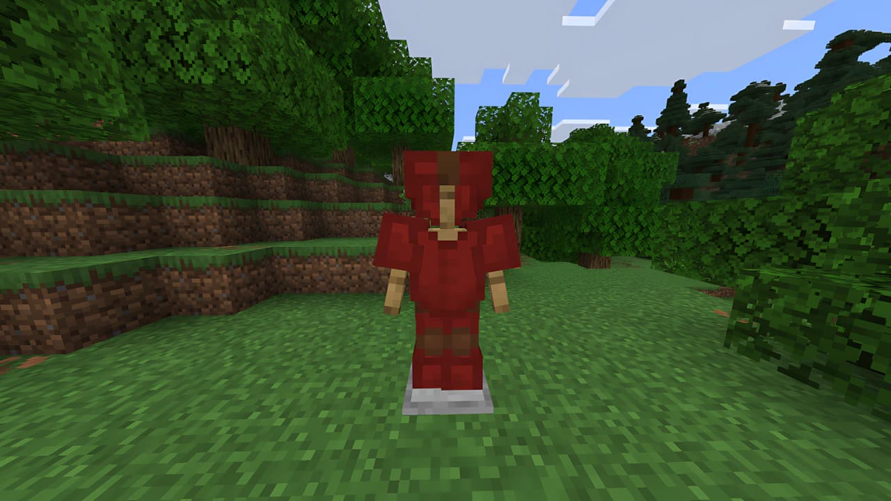 Minecraft character wearing a full set of red dyed leather armor on a grass block background.