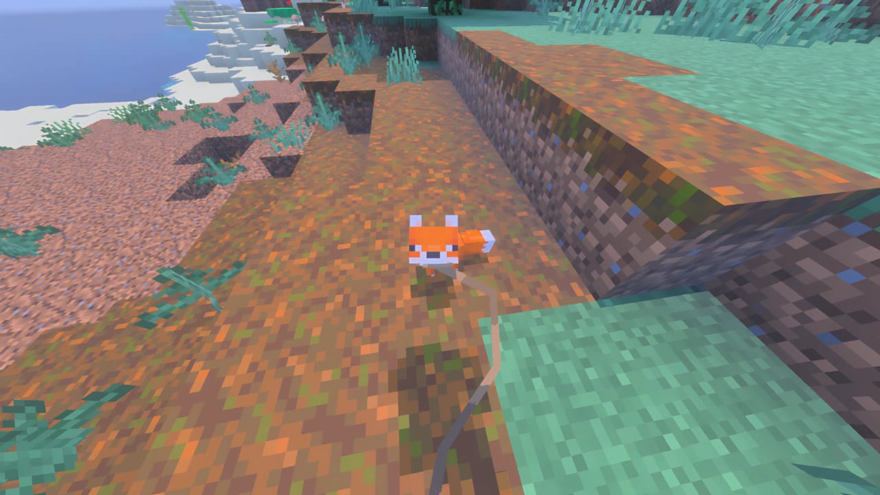 Minecraft baby fox on a lead being tamed in a high-resolution voxel environment, gaming tutorial guide screenshot.