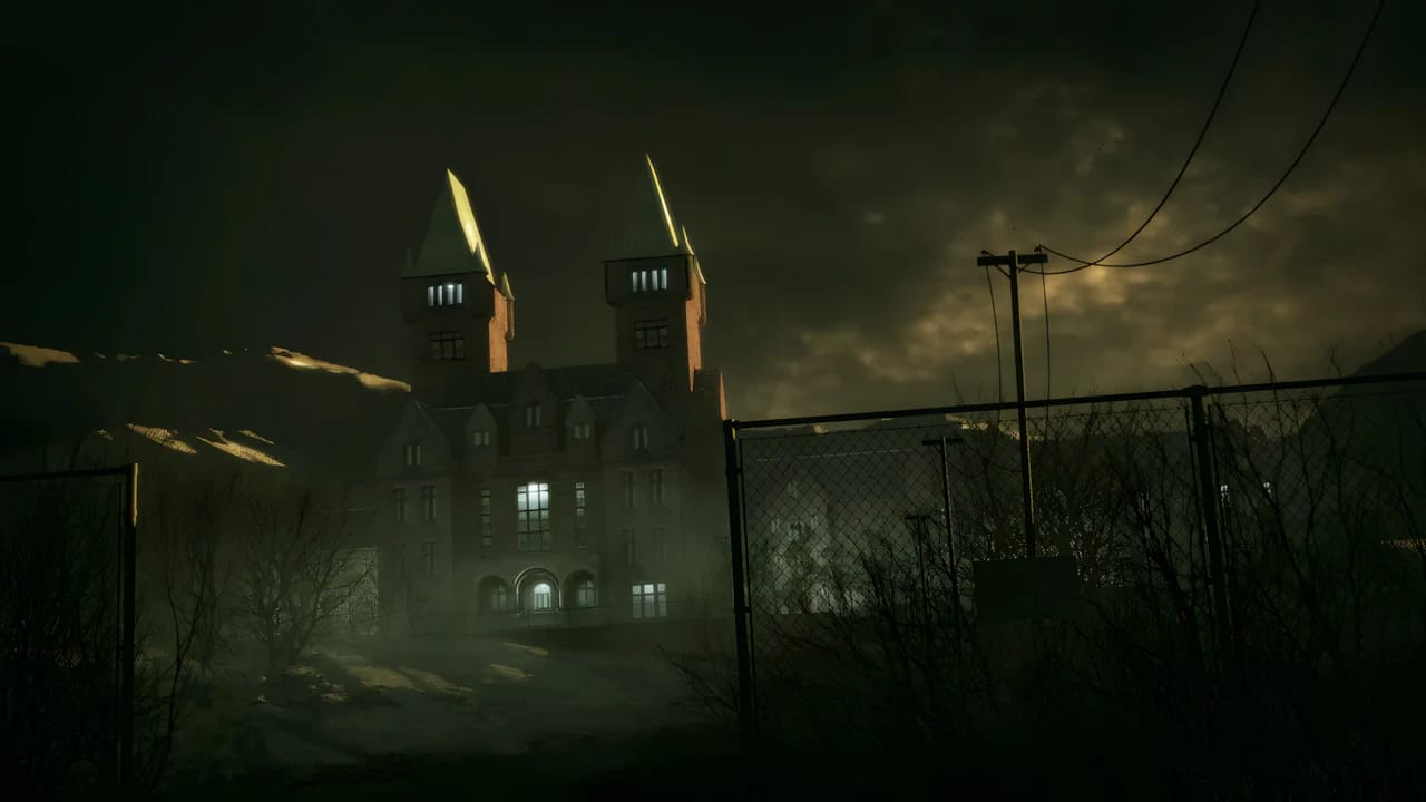 Exterior of Mount Massive Asylum in Outlast, showcasing dark atmospheric lighting and survival horror graphics.