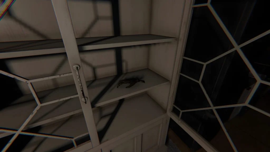Monkey Paw cursed possession inside a wooden cabinet in Phasmophobia, high-resolution textures and dynamic lighting.