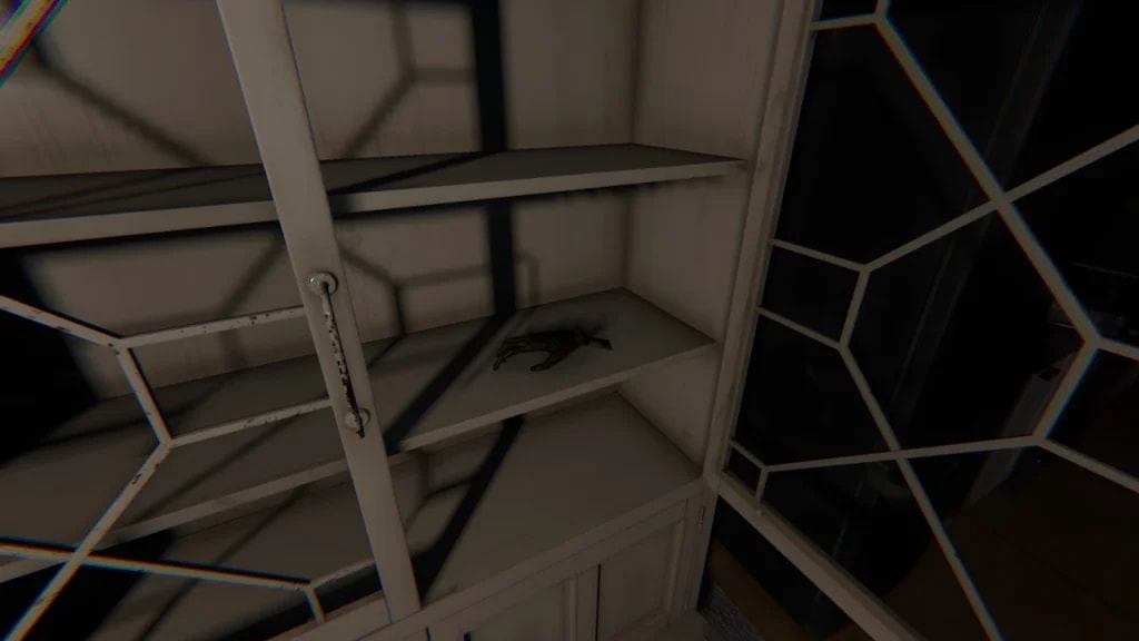 Monkey Paw cursed possession inside a wooden cabinet in Phasmophobia, high-resolution textures and dynamic lighting.