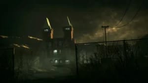 Exterior of Mount Massive Asylum in Outlast, showcasing dark atmospheric lighting and survival horror graphics.