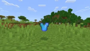 Minecraft diamond chestplate armor floating above grass blocks, illustrating how to disenchant items in-game guide.