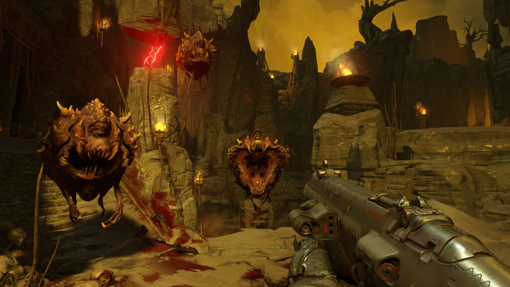 A player facing multiple Cacodemon enemies in a dark, rocky environment in the game Doom.