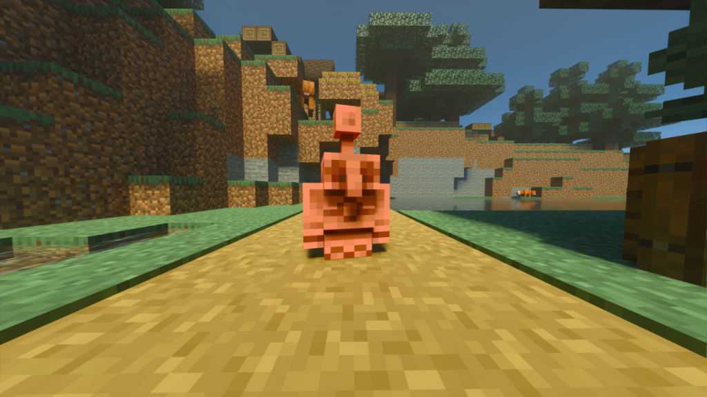 A Copper Golem statue standing on a path in a Minecraft world.