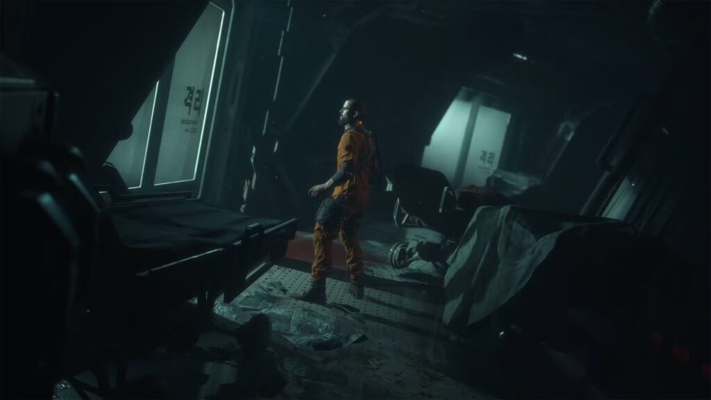 Prisoner in an orange jumpsuit standing in a dark, futuristic corridor.