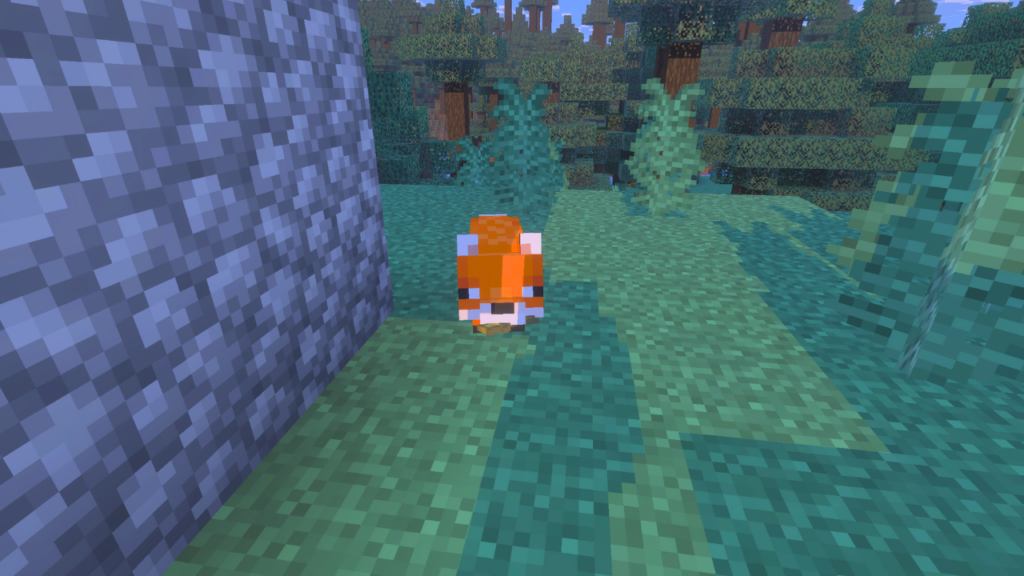A cute red fox standing on a path next to a cobblestone wall in a Minecraft taiga biome.